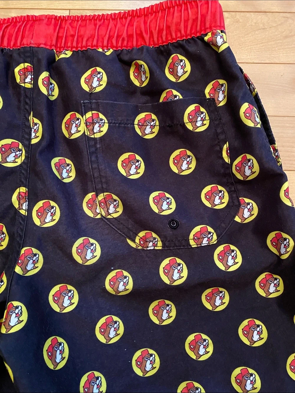 Men's Buc-red Black Swim Trunks with Red Waistband and Yellow Accent Print
